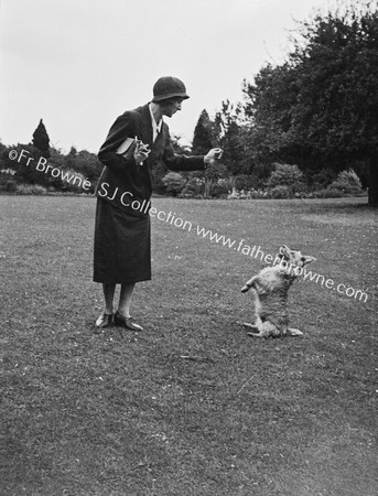 LADY WITH STANDING PUP